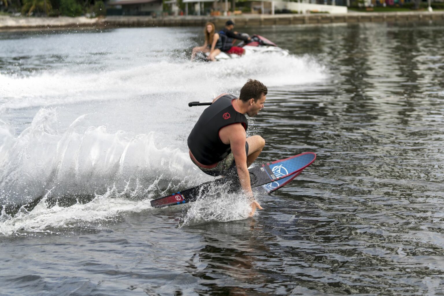 Royalty free photo of water skier being towed by personal water craft.