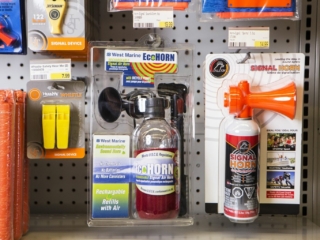 Horns and other safety equipment on the shelves at a retail outlet.