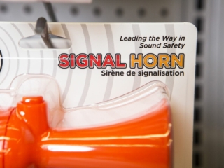 Horns and other safety equipment on the shelves at a retail outlet.